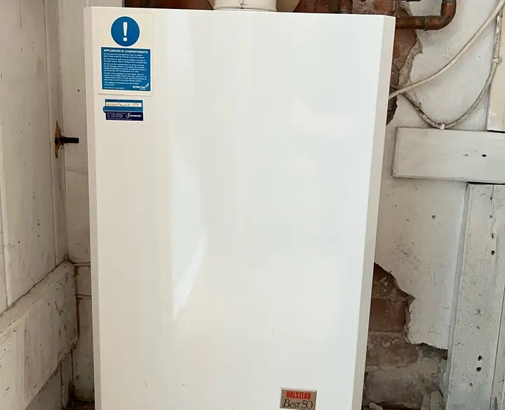 Old Halstead system boiler in a UK home before an ECO4 upgrade